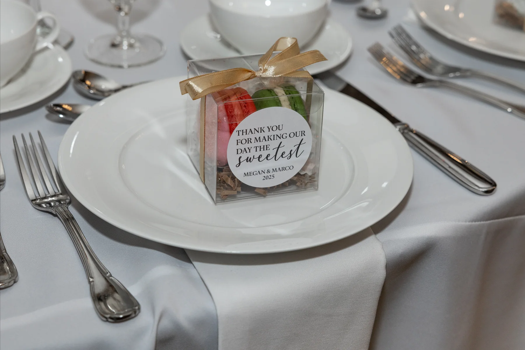 Personalized macaron favor box at a formal place setting